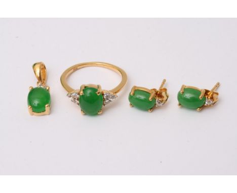 A 925 silver and gold plated jewellery set comprising of a ring inset with jade and six white stones flanking the jade, a pai