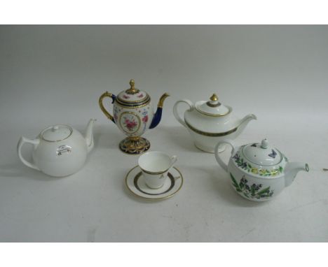 A souvenir teapot from the 1924 Wembley Exhibition, a  a Royal Doulton 'Harlow' pattern teapot,  cup and saucer bearing Royal