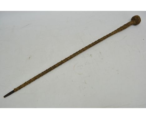 A sailor's rope work walking stick with turk's head knot.