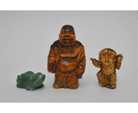 A Carved Tigers eye stone in the form of a Buddha, a jade carving of a frog and one other carving (3)