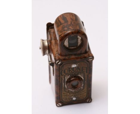 A vintage Coronet midget camera.