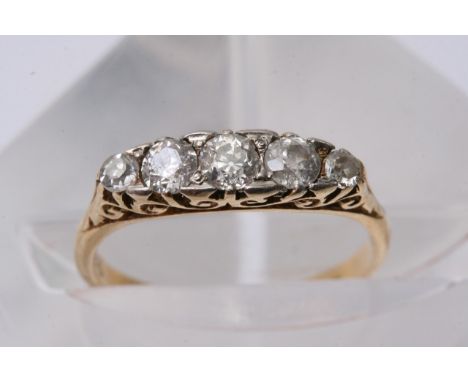 A ladies 9ct gold ring, approximately size L-M, inset with five diamonds