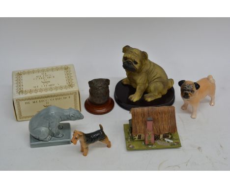 A collection of predominantly canine ceramic including three examples of Pugs a Beswick terrier, a boxed Wade polar bear and 