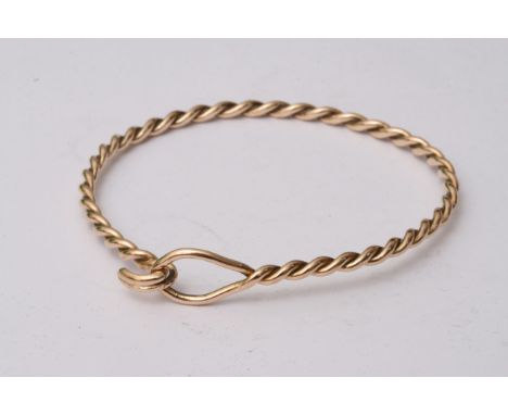 An unmarked yellow gold twist bangle, approximate weight 10.9 grams