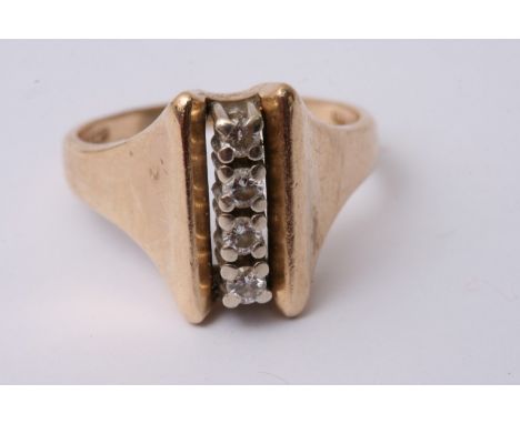 A 9ct ring set with a row of four vertical diamonds. 6g approx