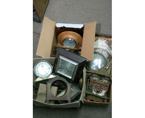 A box containing various barometers and three other boxes of clock parts and clocks. 