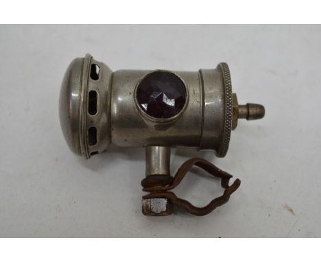 A miniature vintage bike lamp