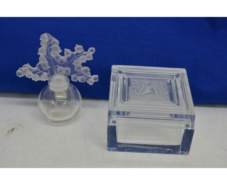 A signed Lalique glass square trinket box having ribbed design with kneeling maiden to centre, etched Lalique mark to base, s