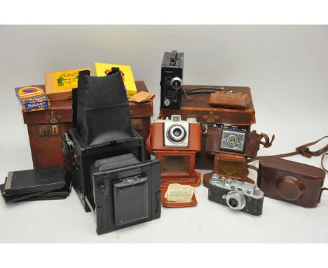 A large box camera and other cameras.