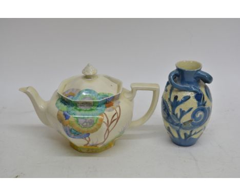 A Clarice Cliff tea pot, and a signed Brannham art pottery vase decorated with a stylised fish, 