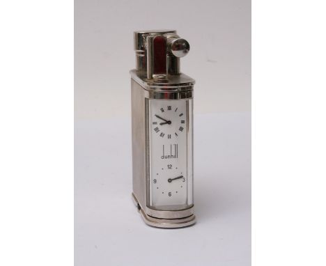 A Dunhill 'Giant' chrome lighter with ribbed effect and clock insert to side, numbered 154/250