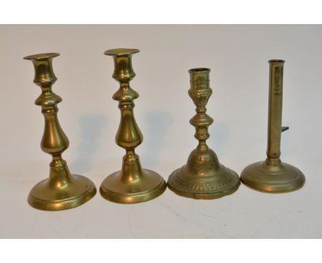 A 19th century French engraved brass candlestick, a pair of English 1800's candlesticks and a push side example