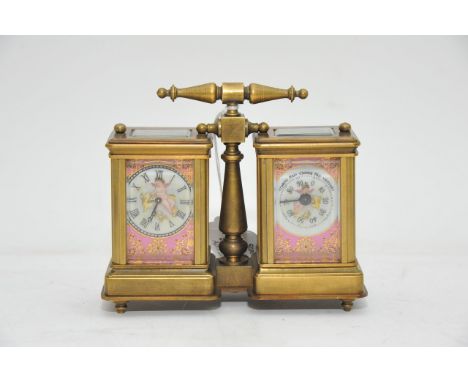 A brass dual desk clock and weather gauge with painted dial featuring cherubs, the other panels featuring traditionally dress