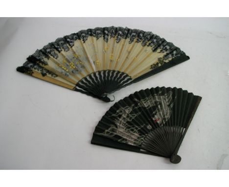 Two antique black stick fans, one having painted fabric