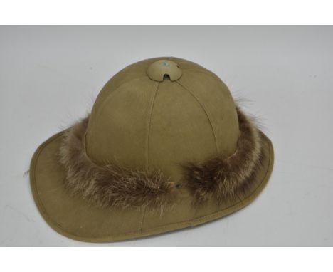 A pith helmet with decorative fur