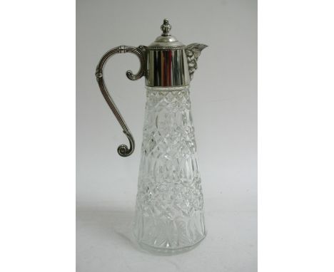 A silver played handled cut glass decanter with typical gothic headed spout