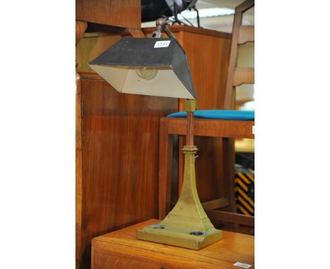 A brass and copper library lamp.