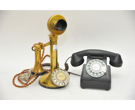 A stick telephone and retro style modern telephone.