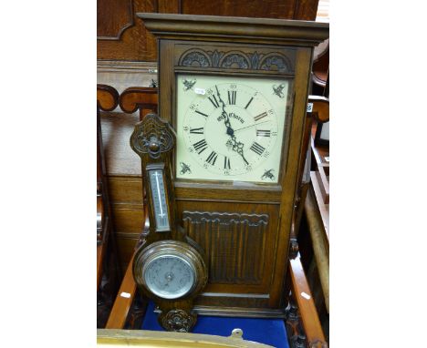 An Old Charm wall clock cabinet, the interior having a row of hooks for keys alongside a barometer