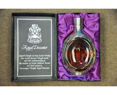 A boxed Dimple Royal Decanter sealed bottle of deluxe Scottish Haig whisky with pewter mounts and paperwork