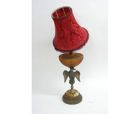 Old table lamp with eagle support and red shade