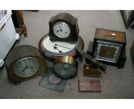 A box containing a bakerlite clock and other clocks various.