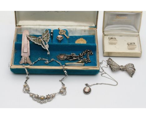 A collection of costume jewellery items including a cameo ring, opal ring, silver bookmark etc.