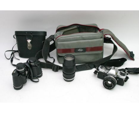 An Olympus camera and a pair of binoculars.