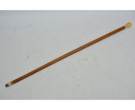 An ivory topped walking stick.