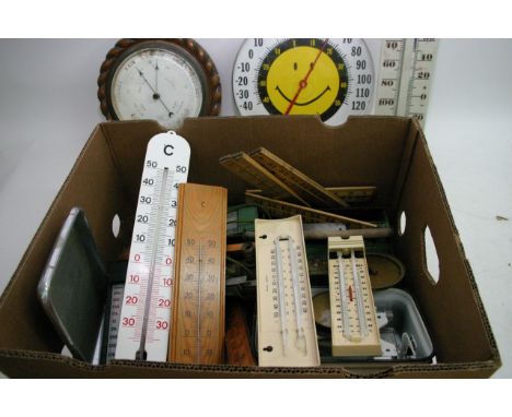An oak wall barometer and various old rules and scales