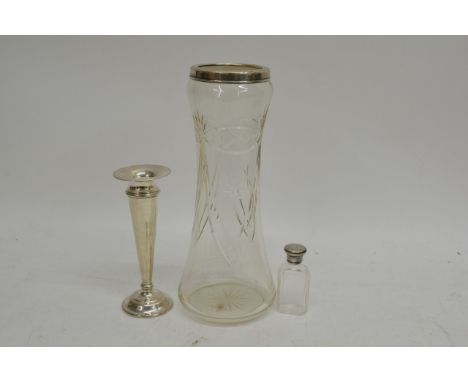 A silver topped scent bottle, silver rimmed glass vase and a silver candlestick (a/f) (3).