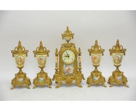 A French style clock with two pairs of side ornaments