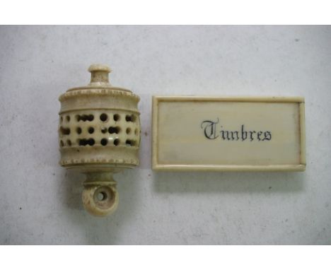 Two ivory items: a French stamp box and a carved container containing jade bead