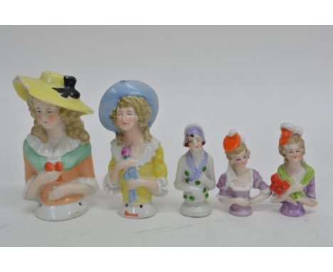 A collection of ten ceramic pin dolls of various design and size