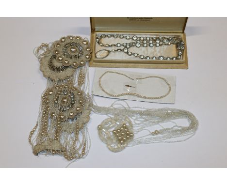 A pearl necklace with yellow metal clasp; a collection of Flapper Girl dress pearls  AF and one other boxed necklace 