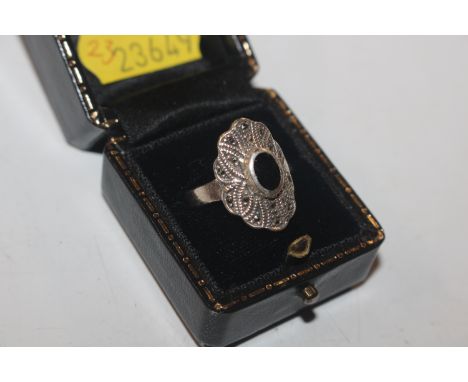 A vintage Sterling silver marcasite and black onyx cocktail ring, size N/O