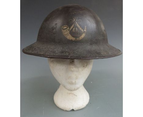 British Army WW1 steel Brodie helmet with regimental insignia to front for the King's Shropshire Light Infantry