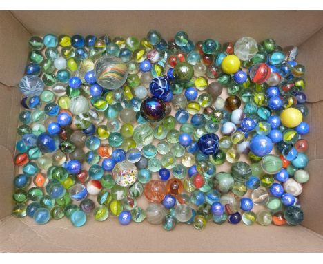 Collection of vintage glass marbles including some with multi-coloured twists, largest 34mm in diameter.&nbsp;