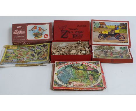 Five vintage wooden jigsaws including Victory, Tuck's and Zig Zag together with an Airfix Robins kit, all in original boxes.&
