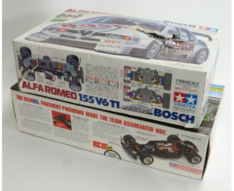 Two 1:10 scale remote controlled model car kits Tamiya Alfa Romeo 155 V6 TI Bosch 58195 and Team Associated BMW RC10 DS, both