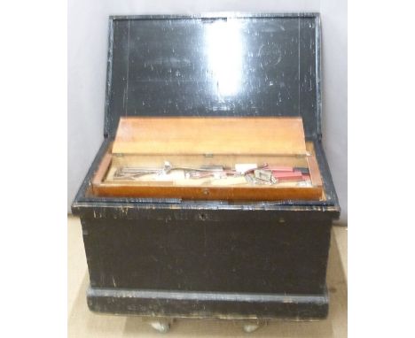 A 19th/20thC painted pine tool chest and contents with fitted interior and four drop handles. Contents include woodworking/ca