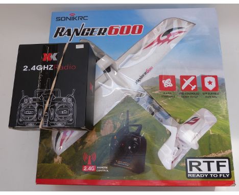 Sonik RC Ranger 600 RTF model aeroplane complete with transmitter, charger etc, together with an XK x 6 2.4ghz radio transmit