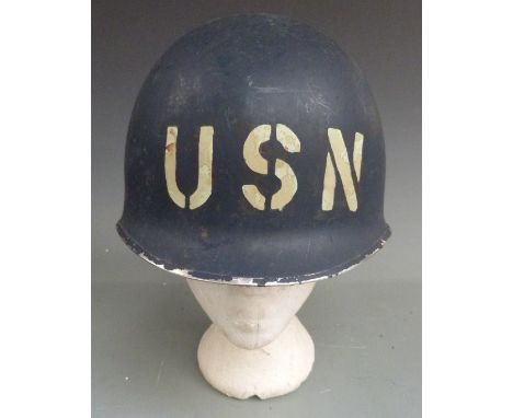 Military helmet painted with USN to front and Pearl Harbour references