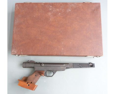 Original Model 10 .177 target air pistol with adjustable wooden grips, trigger and sights, serial number 07434, in fitted car