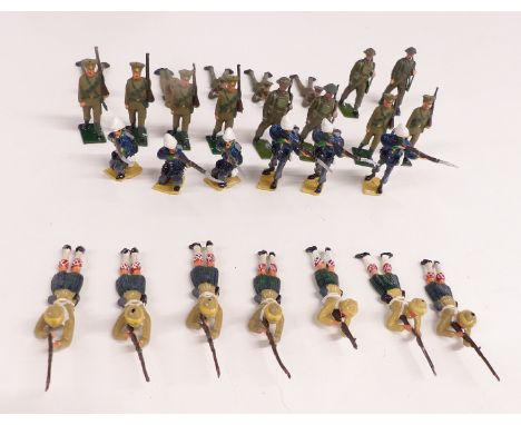 Twenty-seven Britains and similar lead model soldiers including Army infantry