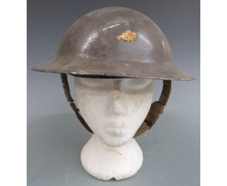 British military steel Brodie helmet with liner and chin strap