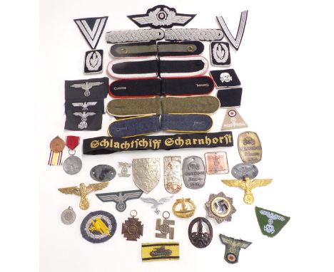 Replica Nazi German badges and insignia to include shoulder boards, Luftwaffe cap badge, U boat, enamel example and fabric in