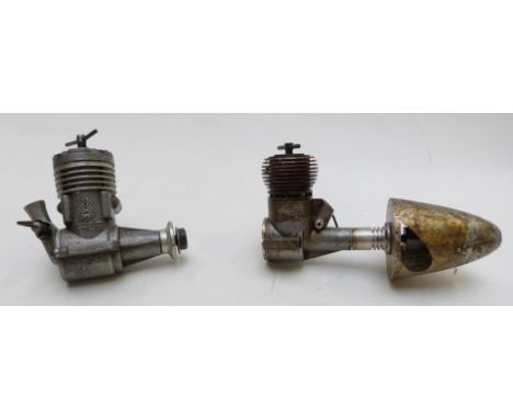 Two vintage compression ignition model aircraft engines, one AMCO the other FROG