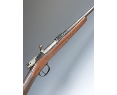 Unnamed .410 bolt-action shotgun with chequered grip and 24.5 inch barrel, overall length 111cm, length of pull 34.5cm, NVSN.