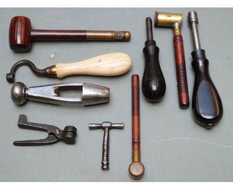 Nine various gun tools including nipple keys, powder and shot measures, bullet moulds, wad punch etc, some with turned wooden